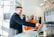 A smiling professional consultant discussing digital transformation with a client in a modern office.