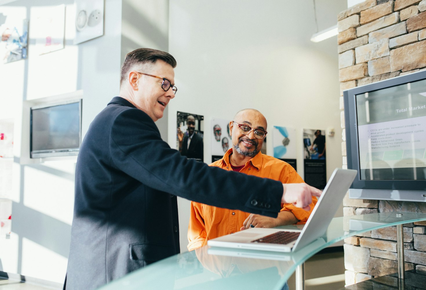 Two people shaking hands to close a business deal.