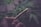 A close-up of a beautifully rolled tobacco with a scenic background.