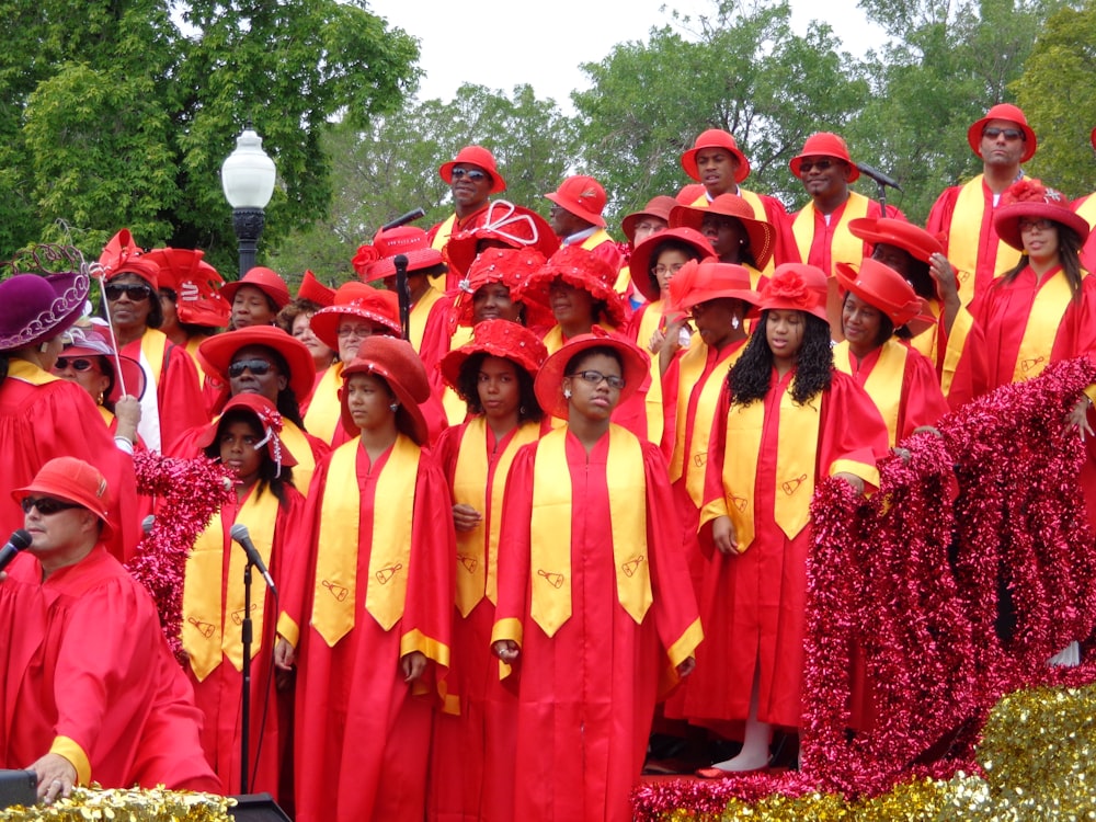 women wearing yellow-and-red dress