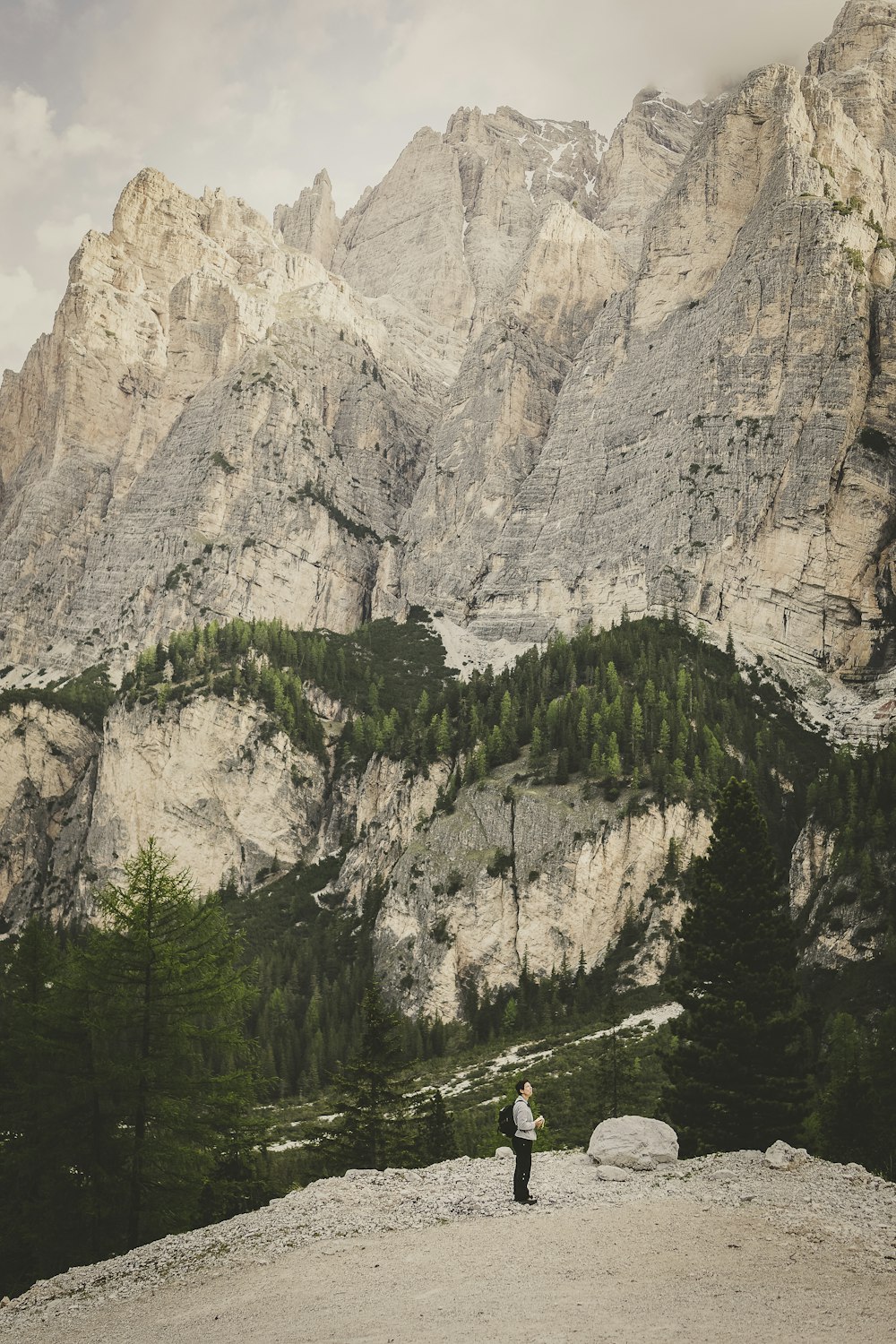 man standing on mountain peak