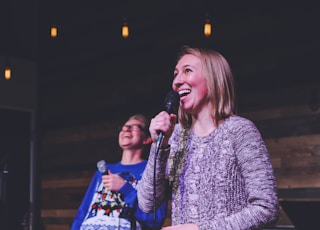 woman holding microphone