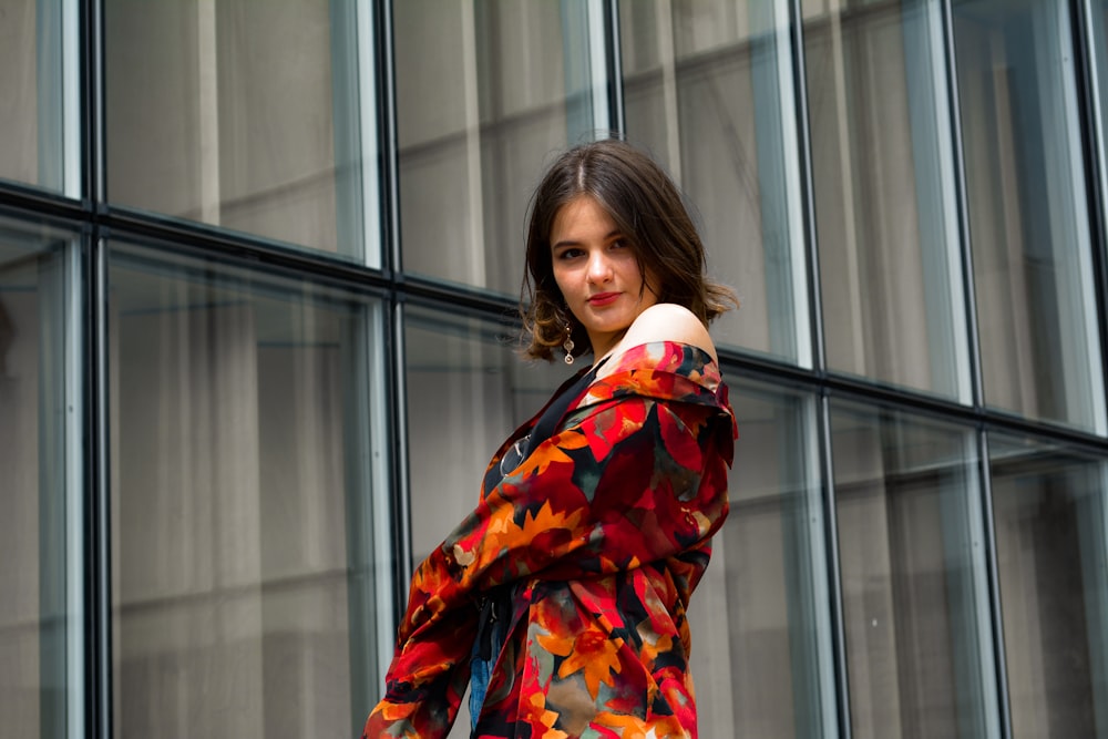 woman wearing orange and multicolored floral jacket