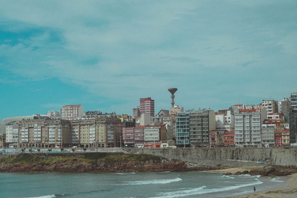 body of water across city buildings during daytime