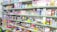 A store shelf filled with various colorful stationery items and art supplies, including pens, pencils, notebooks, and paint sets. The shelves are well-organized, displaying products in various vibrant packages. Some toy items and educational kits are also visible.