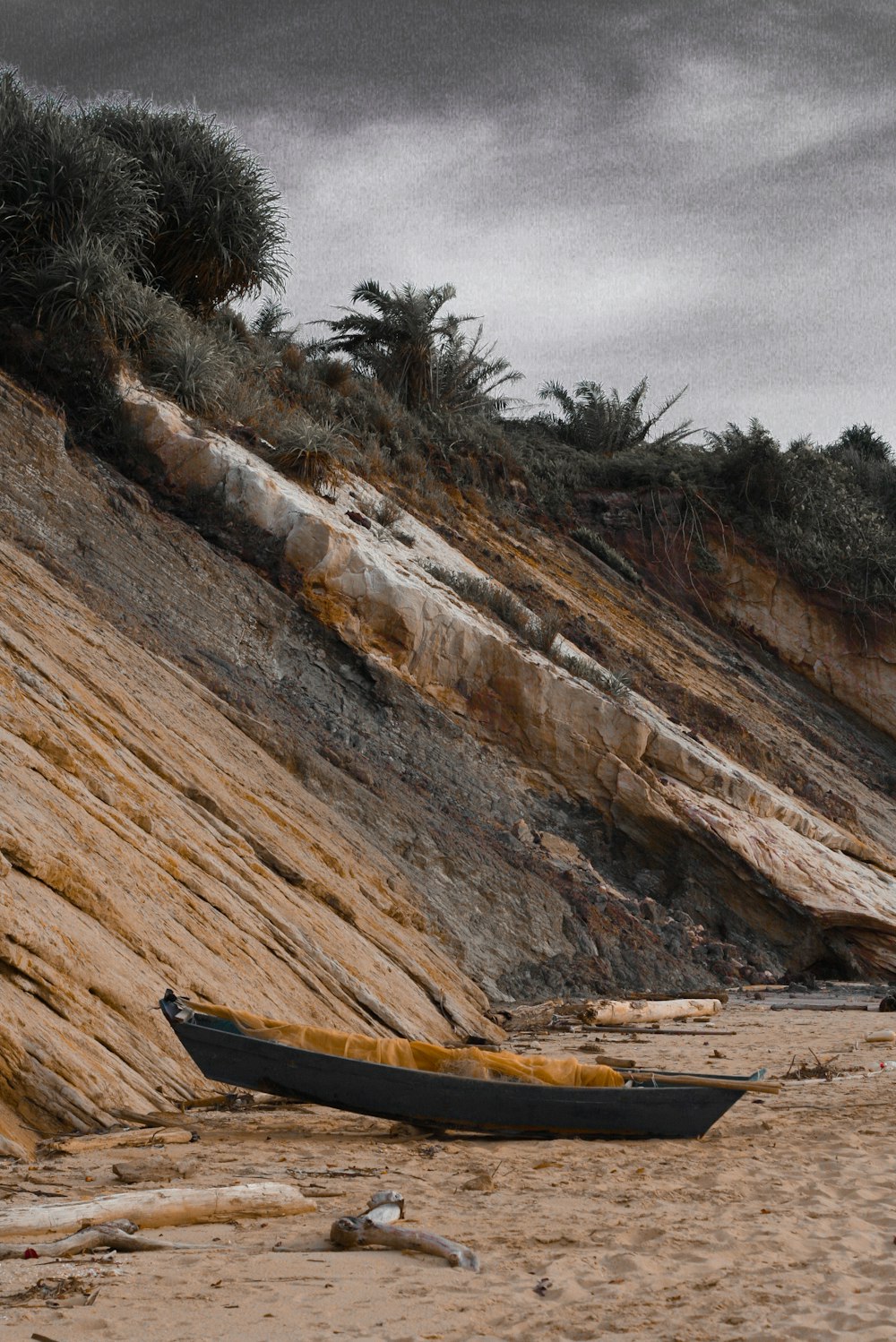 gray canoe near mountain
