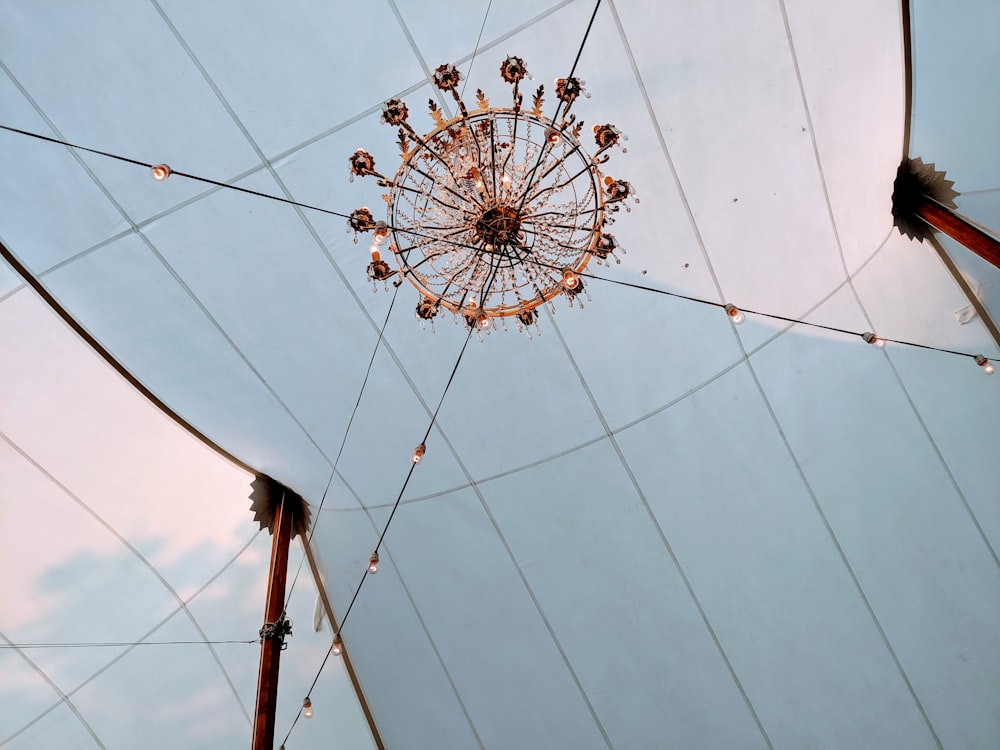 a chandelier hanging from the ceiling of a tent