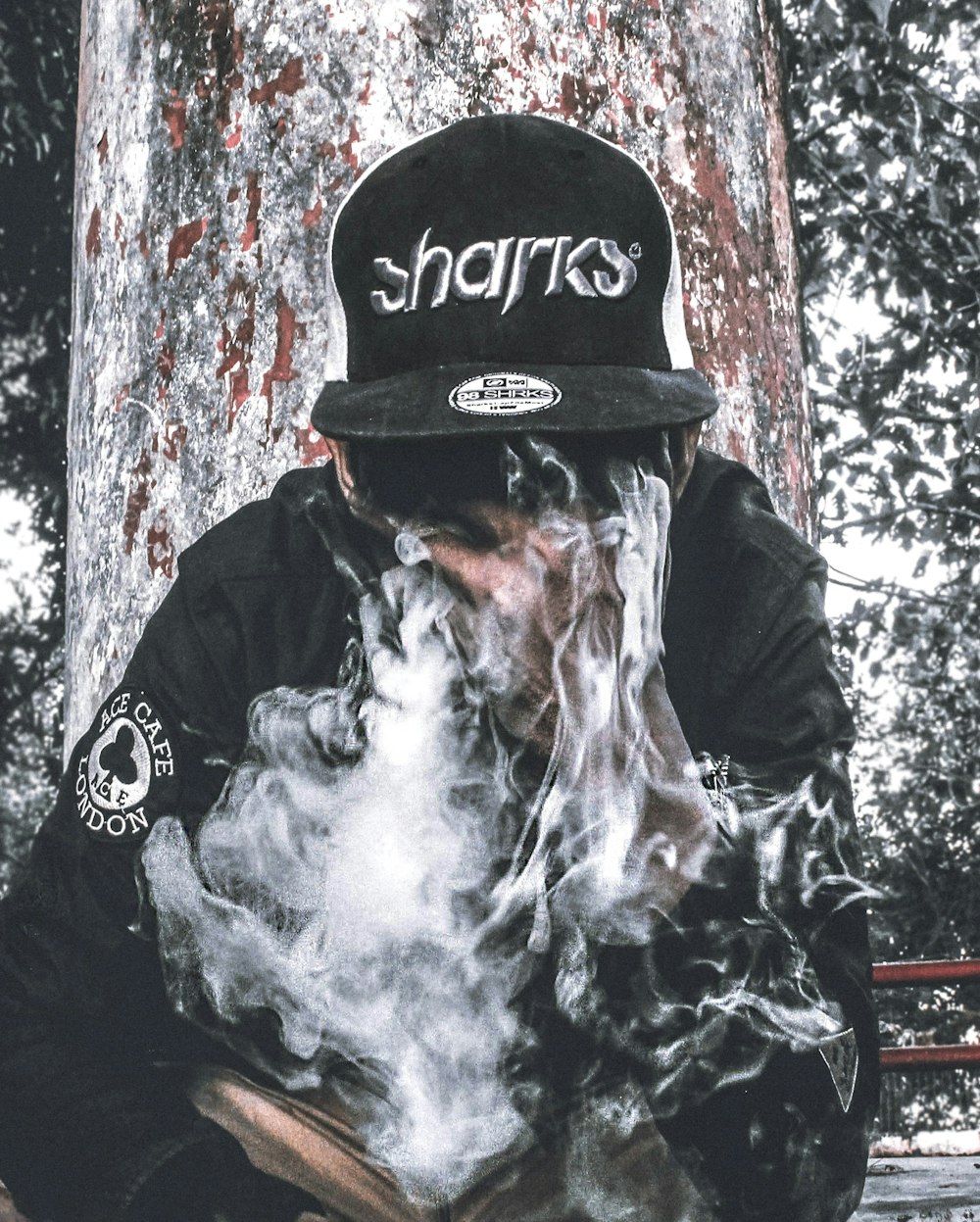 man wearing black Sharks cap and jacket