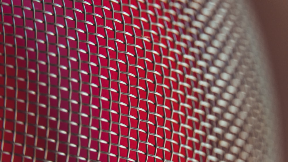 a close up of a red and white object