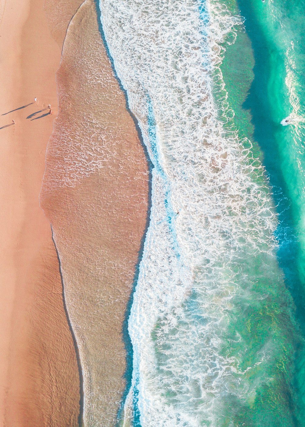 an aerial view of a beach and ocean