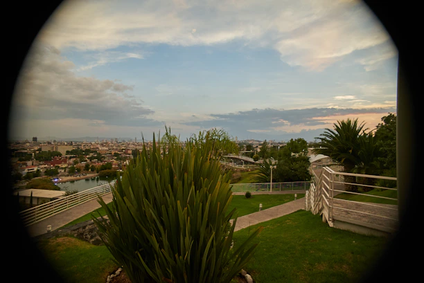 A serene view of green landscaped gardens at Metroplex City in Joka.