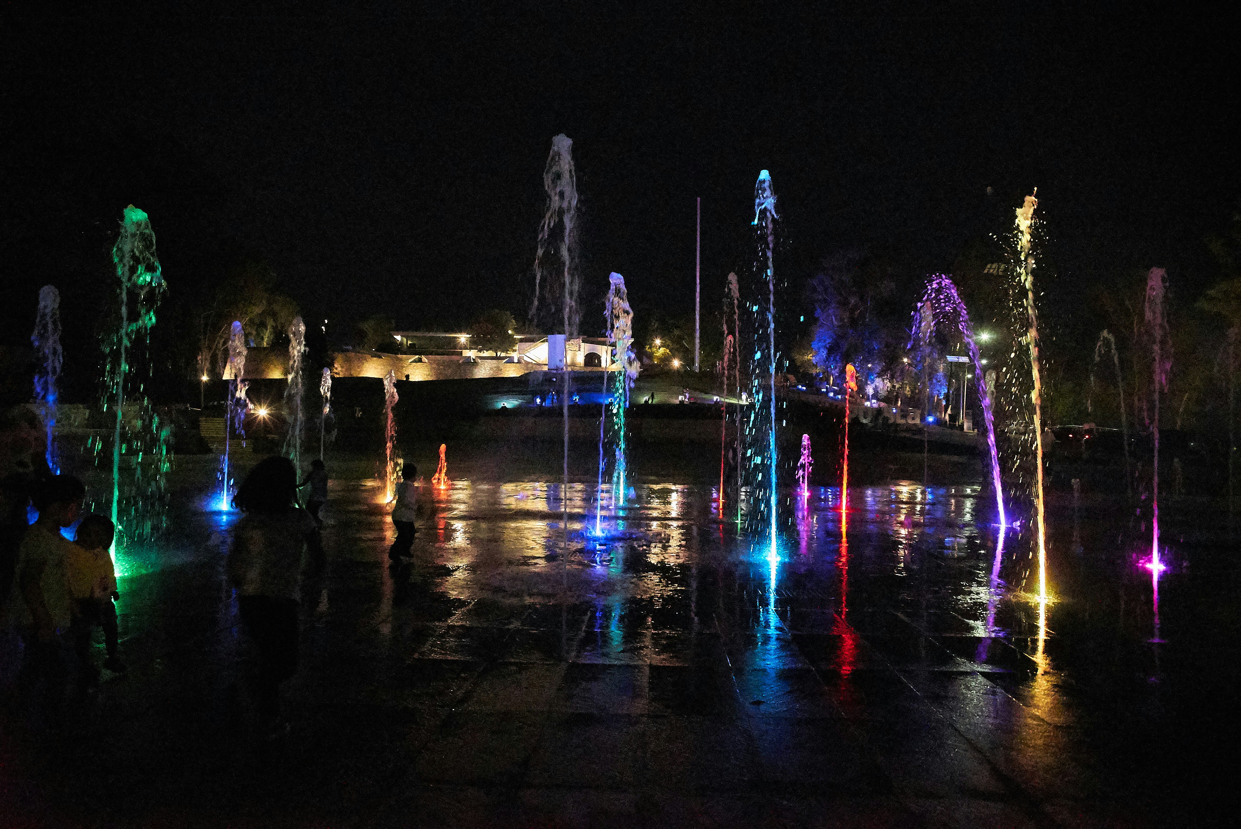 powered-on water fountain during nighttime