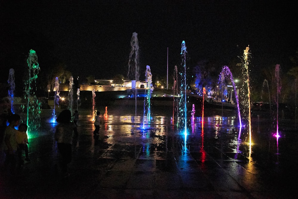 powered-on water fountain during nighttime