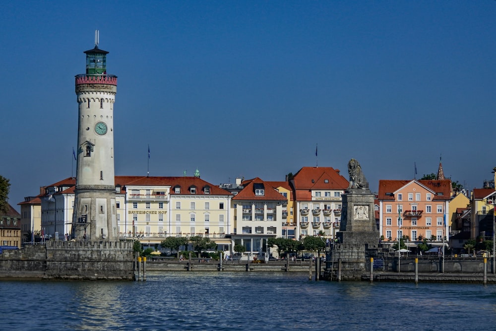 architectural photo of a white lighthouse and buildings