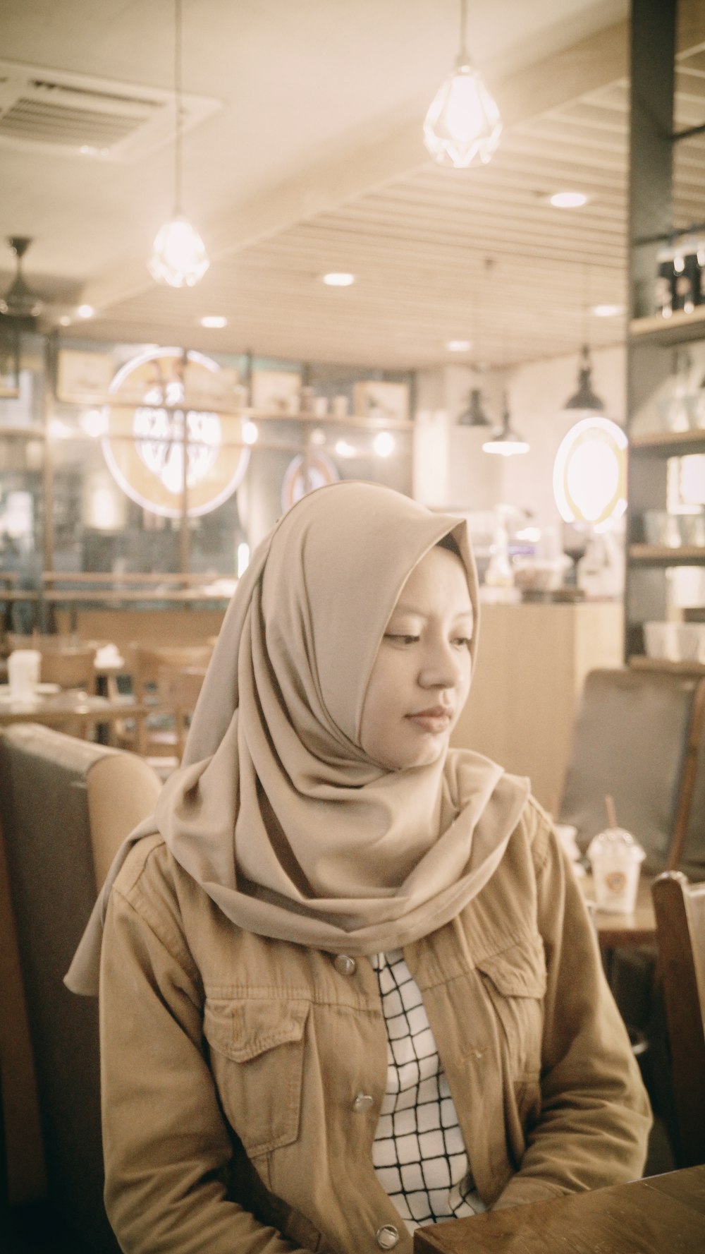 woman sitting in front of table