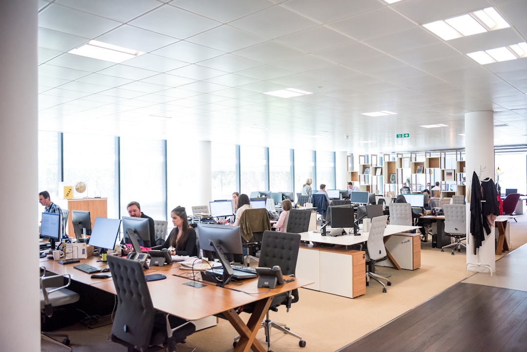 Busy employees working on their computers, exploring enterprise search and its impact on productivity