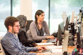 unknown persons using computer indoors