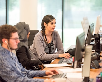 unknown persons using computer indoors