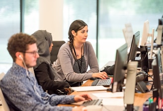 unknown persons using computer indoors