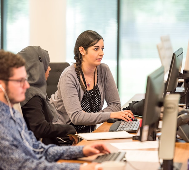 unknown persons using computer indoors