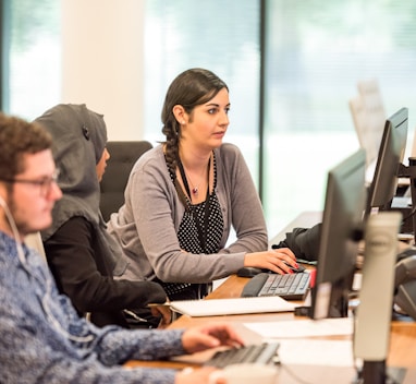 unknown persons using computer indoors