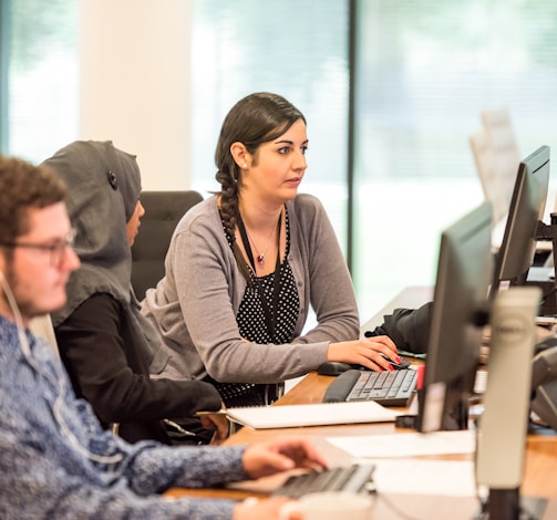 unknown persons using computer indoors