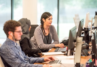 unknown persons using computer indoors