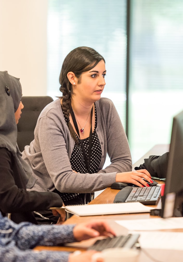 unknown persons using computer indoors