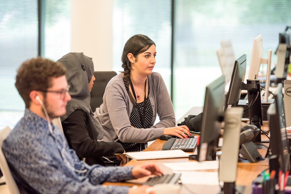 unknown persons using computer indoors