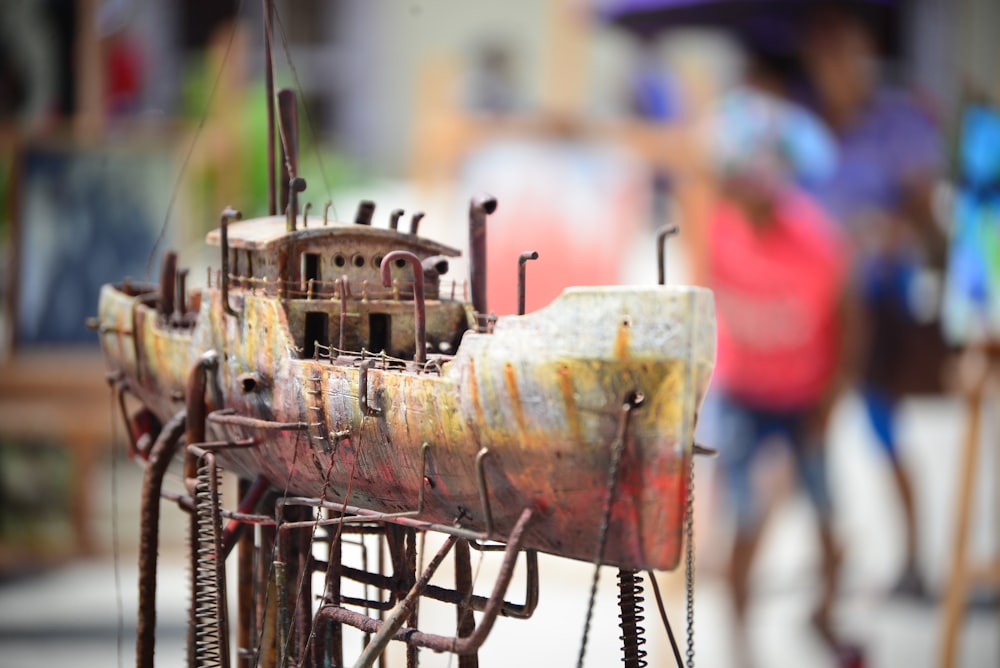 shallow focus photography of gray and brown galleon miniature