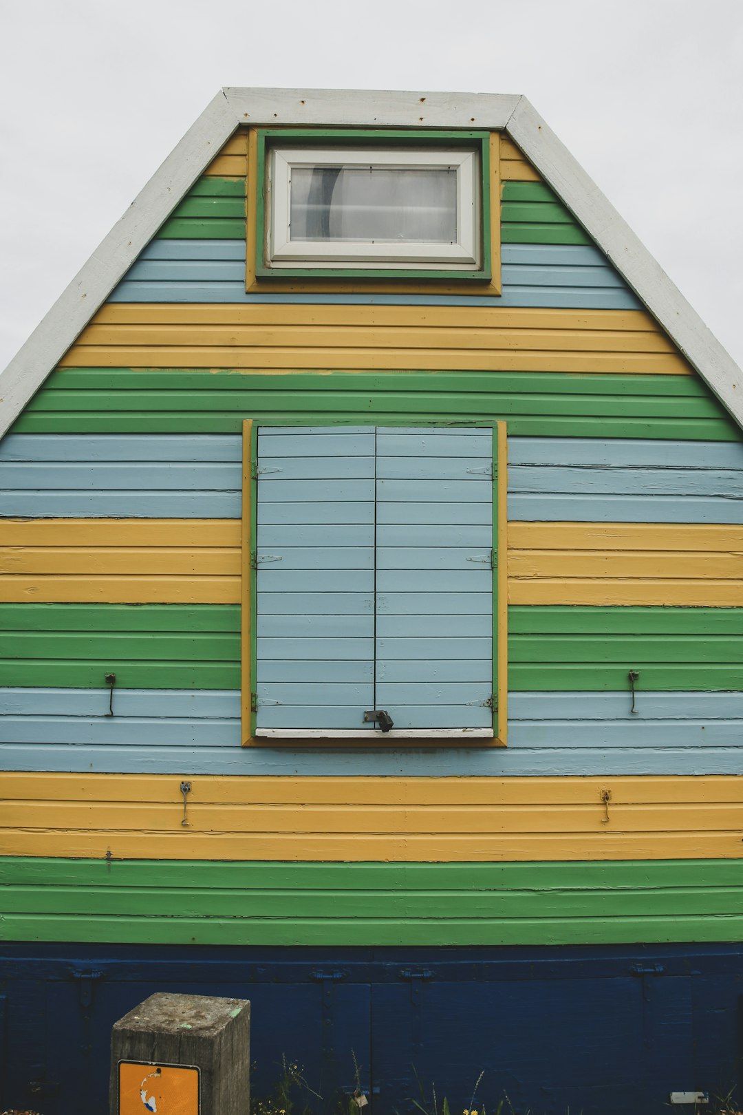 green and yellow wooden house