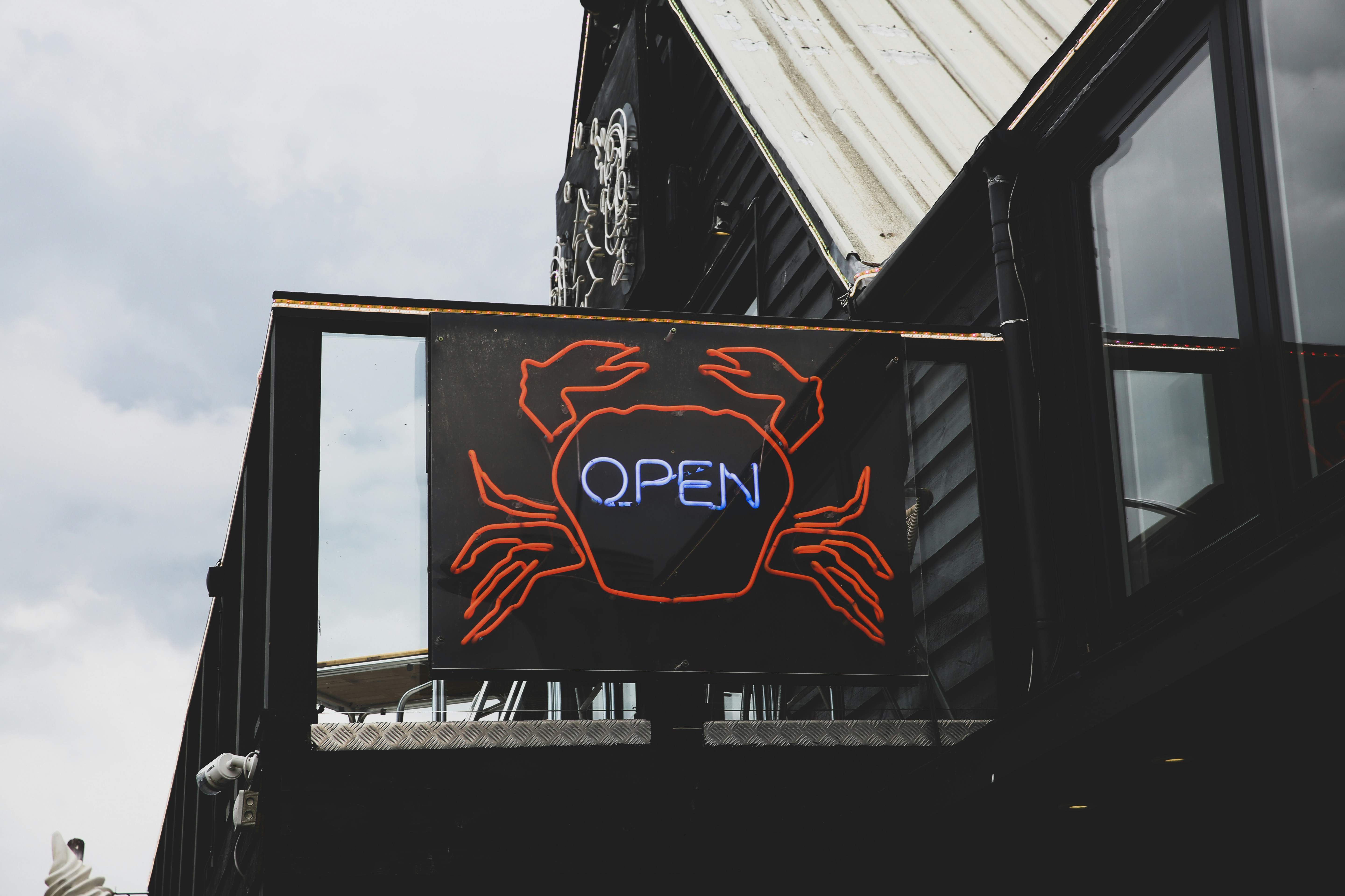 blue and red open neon signage