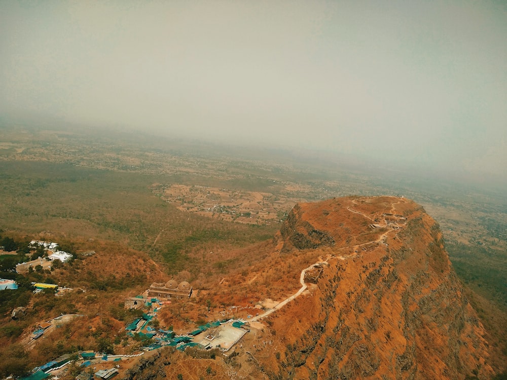 an aerial view of a mountain with a road on it