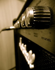 Close-up of a sleek stereo multi amplifier with glowing controls