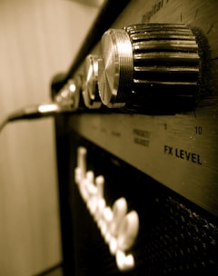 Close-up of a sleek stereo multi amplifier with glowing controls