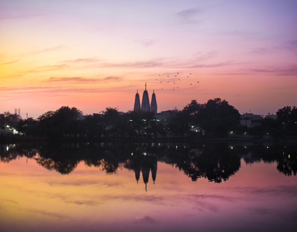 silhouette of building mirror on lake scenery