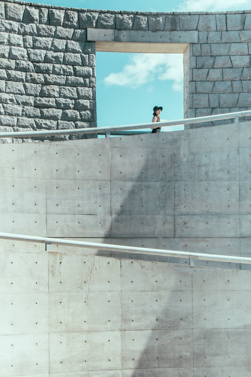 person standing on balcony during daytime