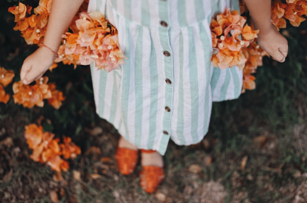 girl wearing teal and white striped dress