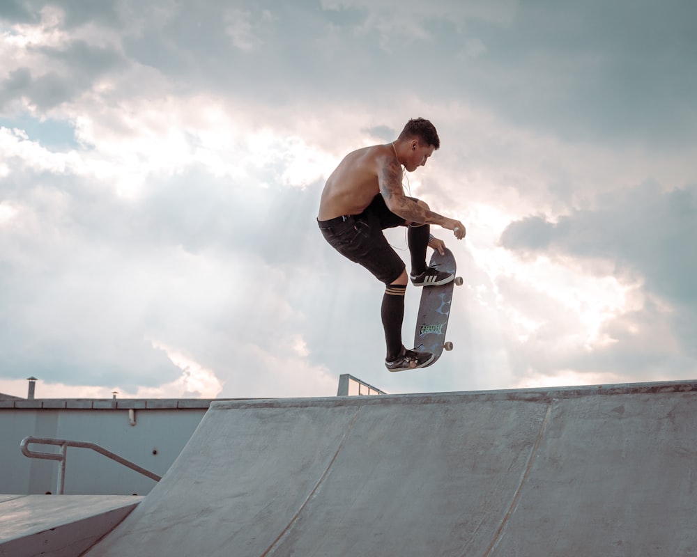 man skateboarding on ramp