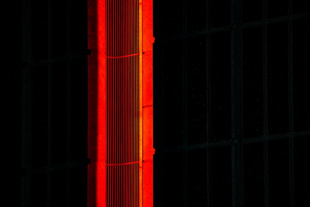 a tall building with a red light on it's side