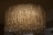 A large, ornate chandelier with numerous hanging crystal prisms that create a shimmering and luxurious effect. The lighting casts a warm, ambient glow, with intricate patterns created by the reflections and refractions of the crystals.