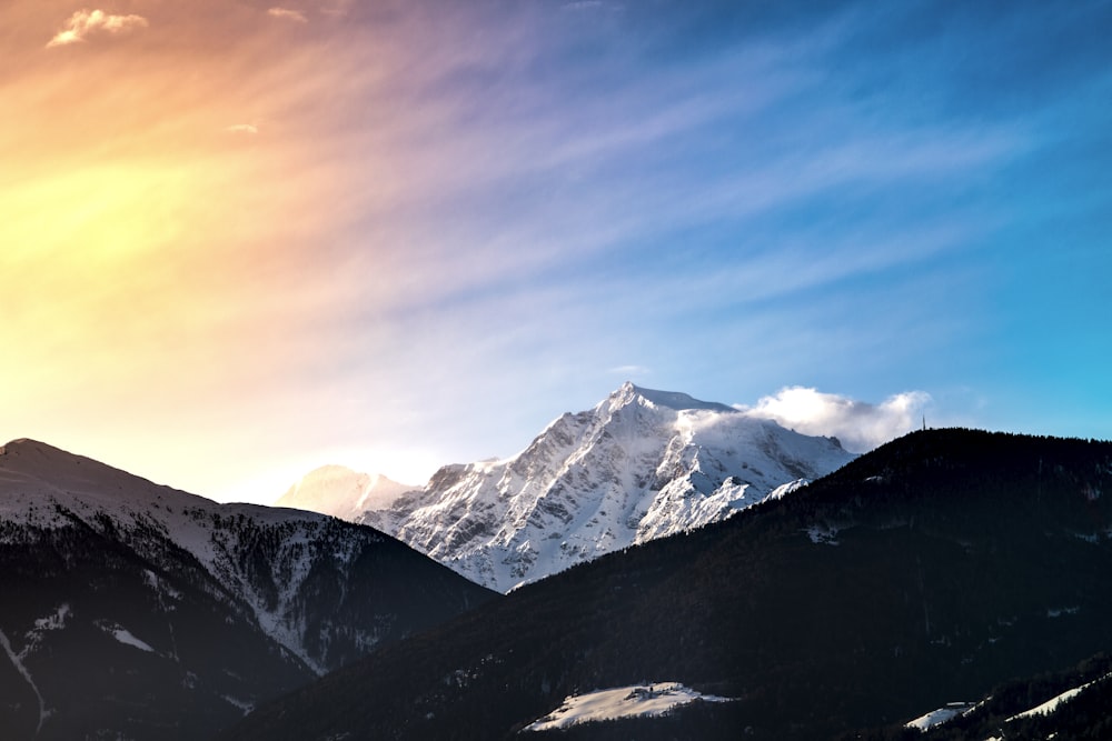 snow covered mountain during daytime