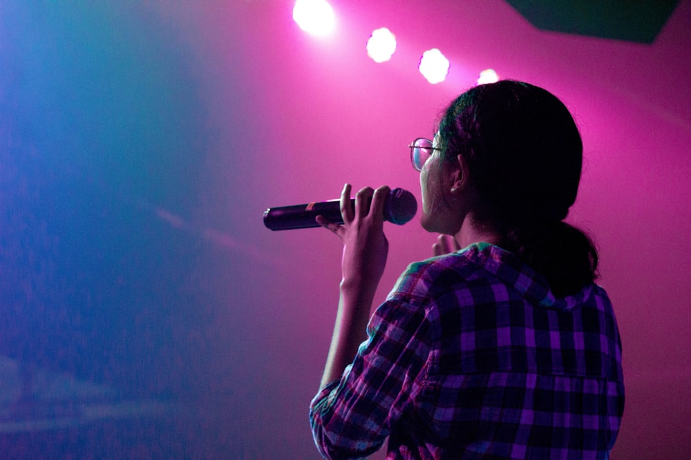 woman holding microphone