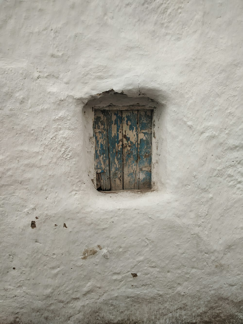 blue and white painted wooden window