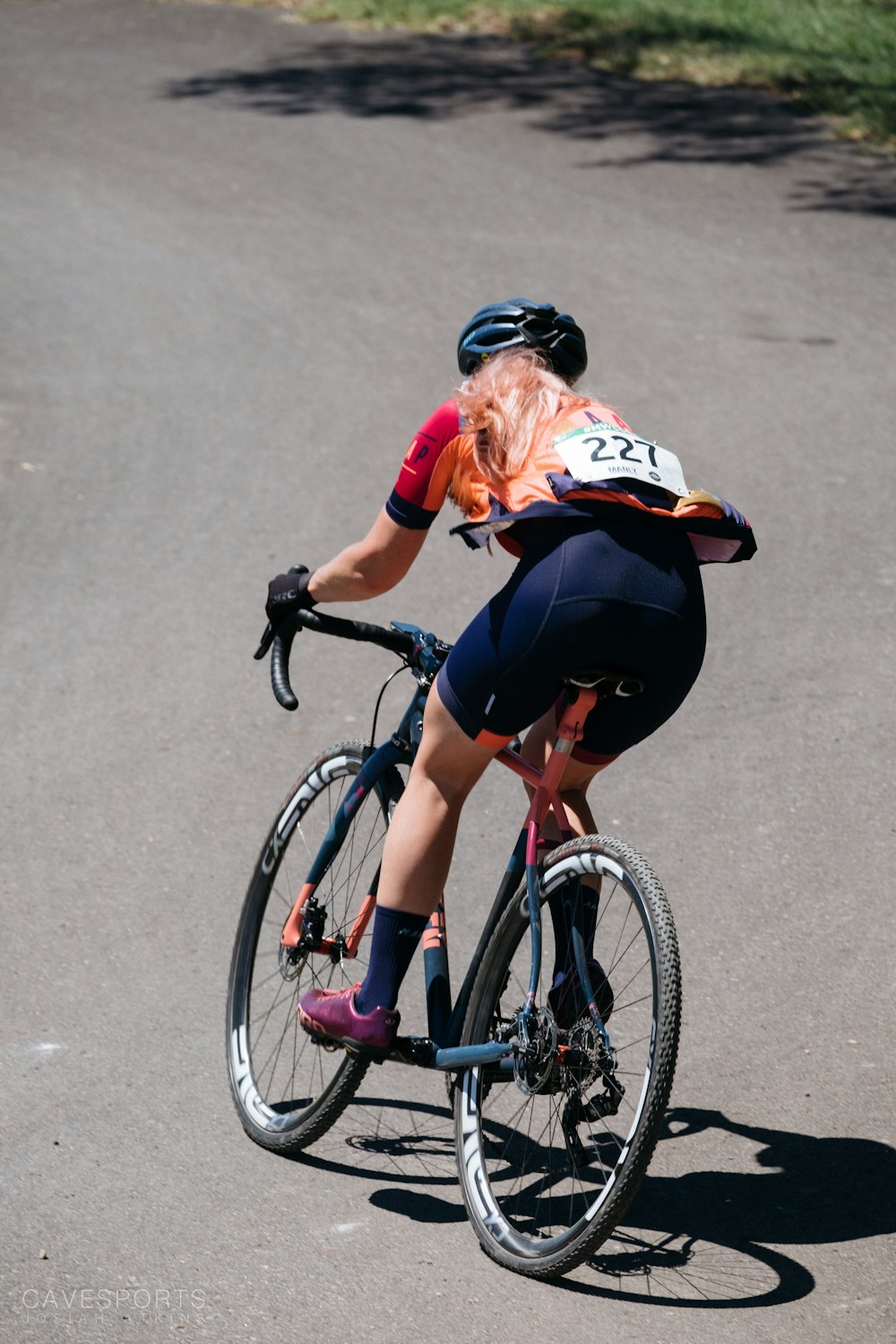 person riding road bike during daytime