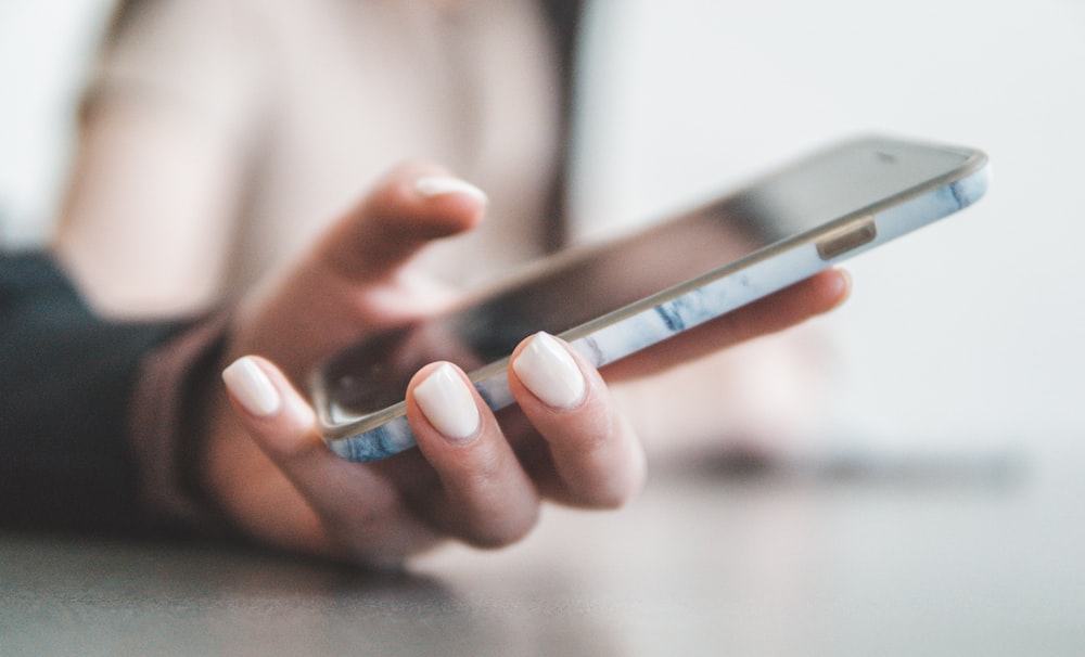 person holding black smartphone