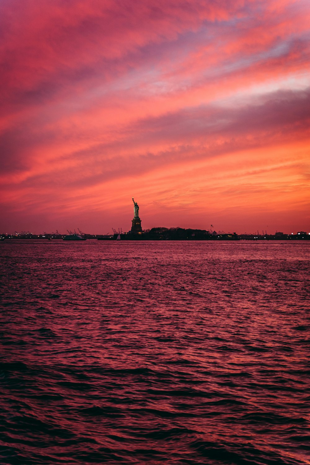 silhouette photo of body of water during golden hour