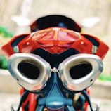 Side view of a sleek motorcycle with a custom paint job and upgraded exhaust.