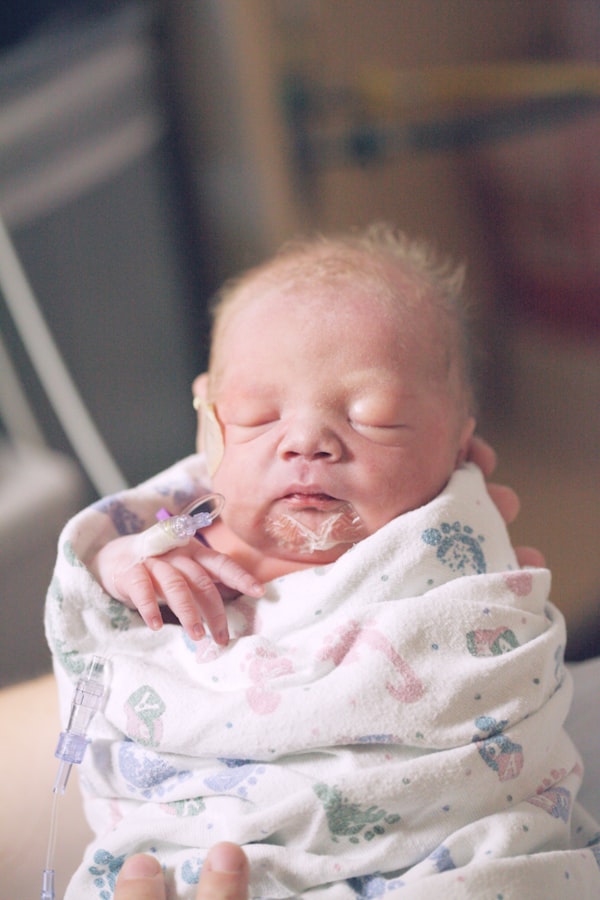 swaddled preemie, swaddled newborn baby, sick newborn