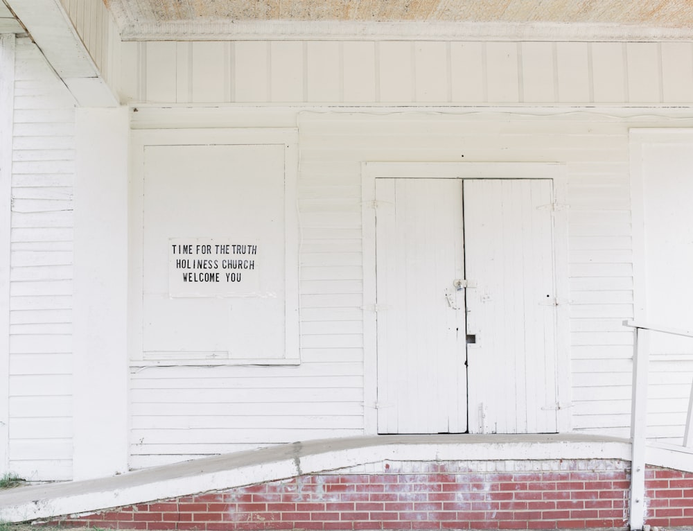 white wooden door near ramp